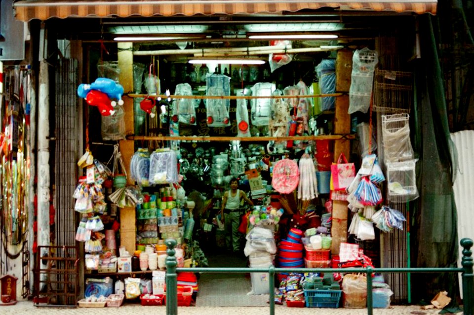 Person Wearing White Tank Top Inside His Store