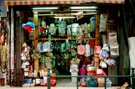 Person Wearing White Tank Top Inside His Store