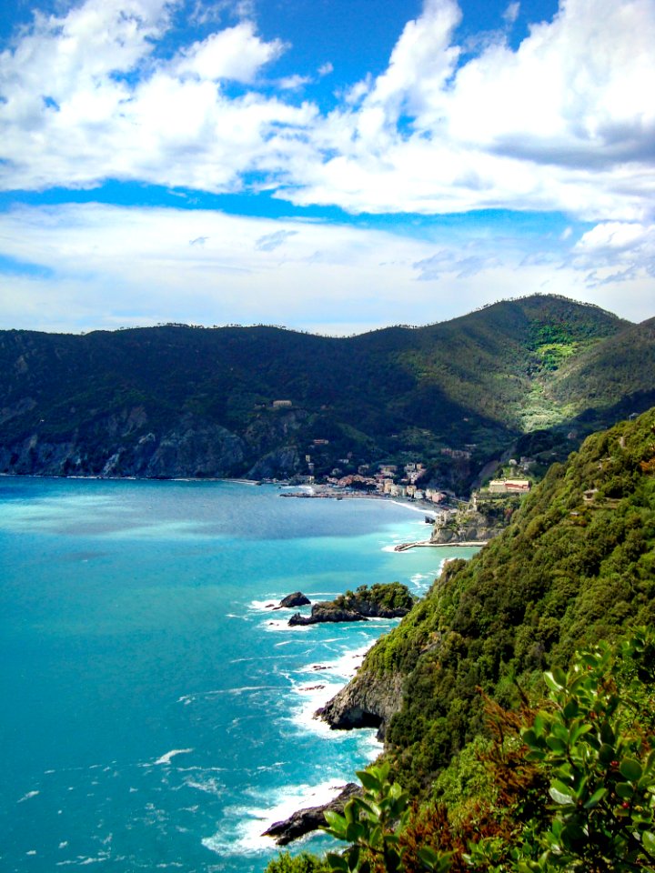 Photo Of Mountains Beside Body Of Water photo