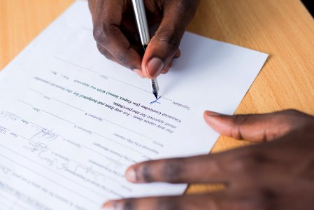 Person Signing Paper photo