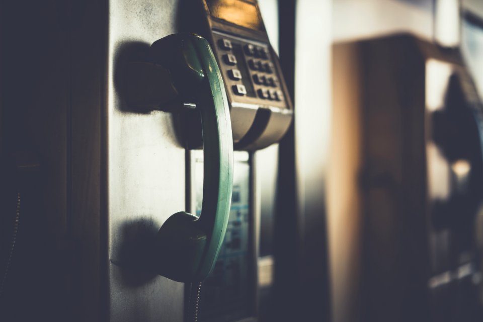 Selective Focus Photo Of Green Telephone