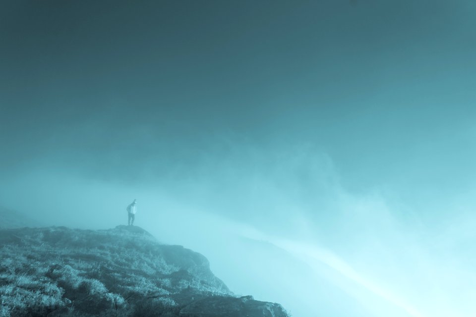 People Standing On Cliff