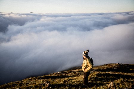 Man Standing On Top Of Moutain
