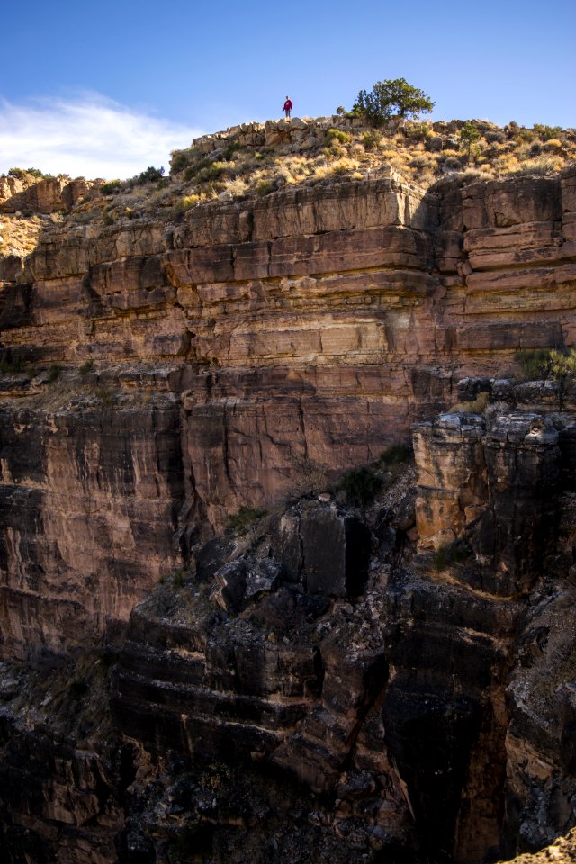 Man Standing On Cliff photo