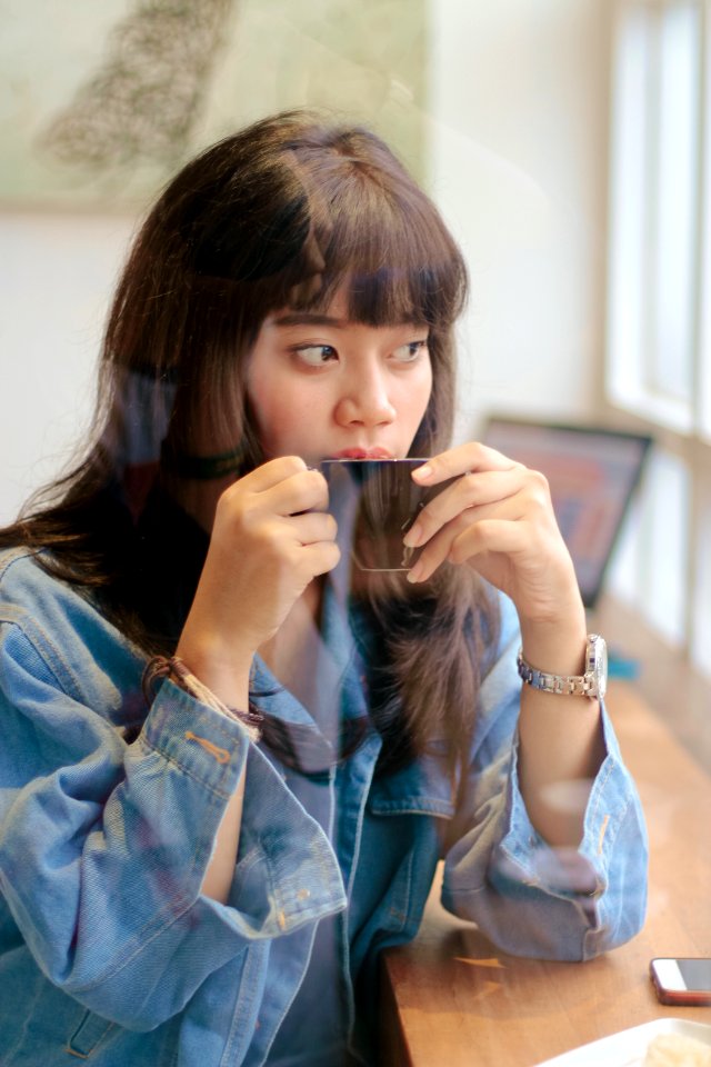 Woman Sipping Coffee photo
