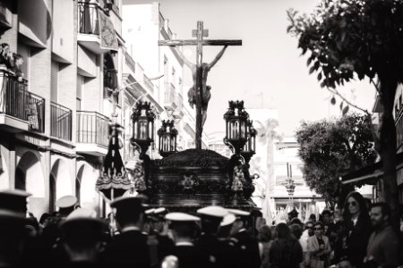 Greyscale Photo Of Group Of People Carrying Crucifix photo