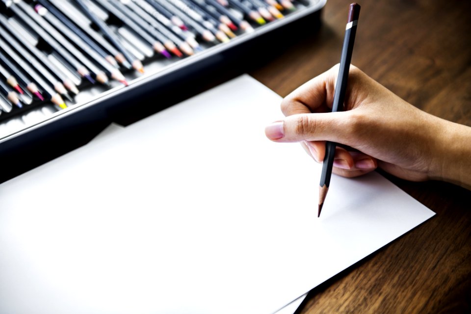 Person Holding Black Pencil