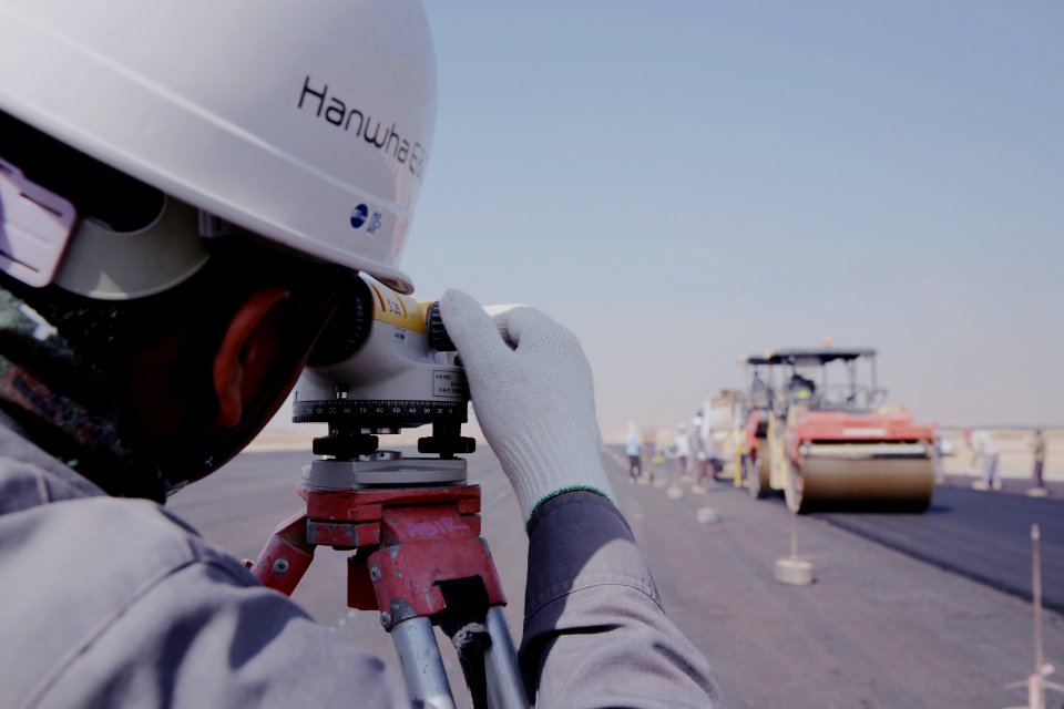 Man Wearing White Gloves Using Telescope