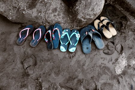 Assorted Flip-flops On Sand