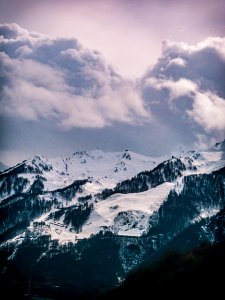 Photography Of Snow Capped Mountain Under Cloudy Sky photo