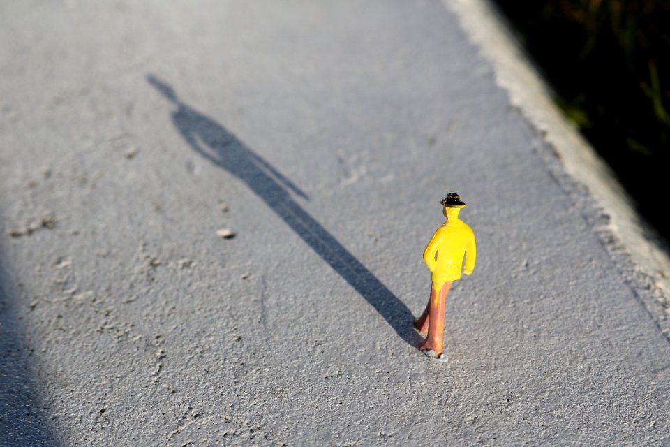 Close-Up Photography Of Brown And Yellow Toy Figure