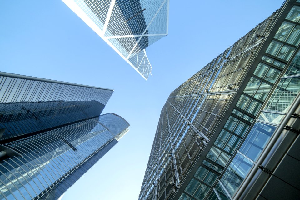 Low Angle Photography Of Buildings Under Blue And White Sky photo