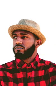 Man Wearing Black And Red Plaid Top And Beige Hat