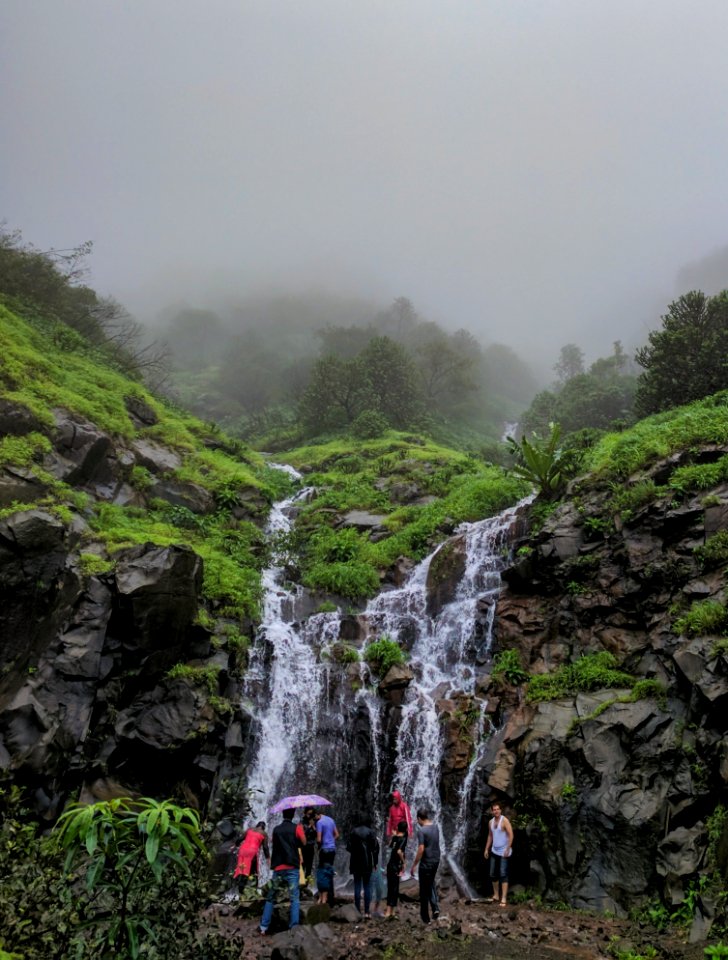 People In Front Of Waterfalls