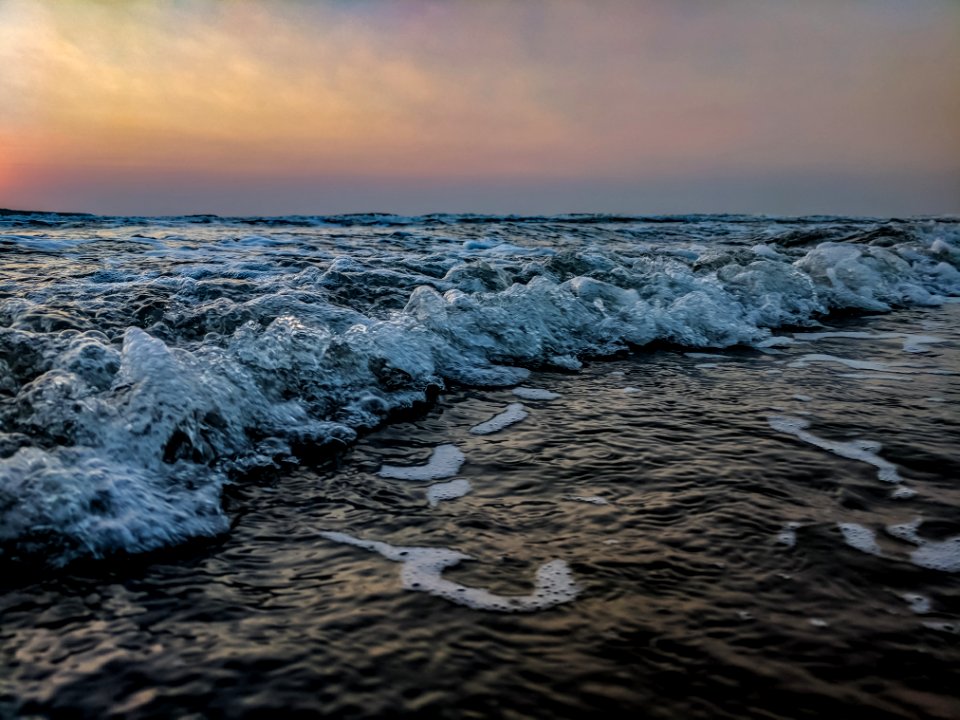 Body Of Water During Sunset