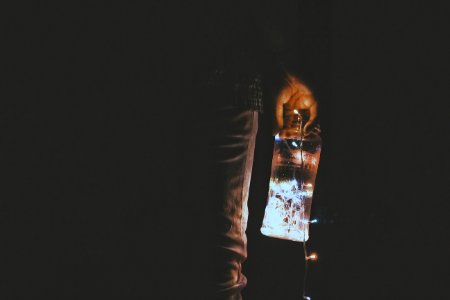 Person Holding Glass Jar photo