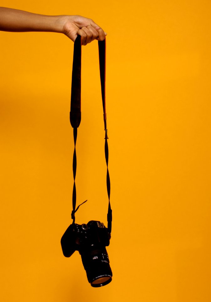 Photo Of Person Holding Black Dslr Camera