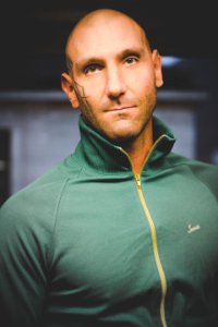 Man Wearing Green Zip-up Top photo