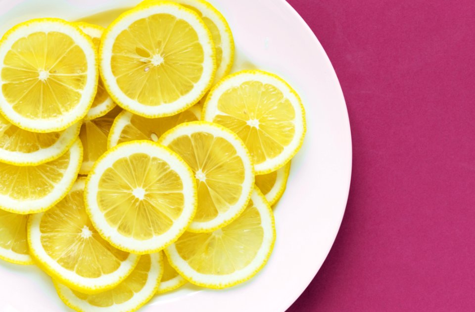 Photo Of Sliced Lemons On White Plate