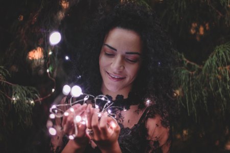 Close-Up Photography Of Woman Holding Lights