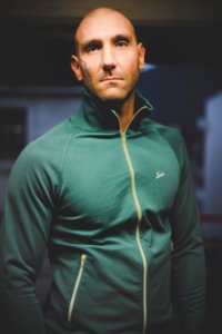Photo Of Man In Green Zip-up Jacket photo