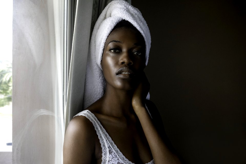 Closeup Photo Of Woman Wearing White Top Looking On Camera
