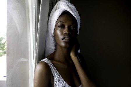 Closeup Photo Of Woman Wearing White Top Looking On Camera photo