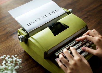Person Typing On Green Typewrite