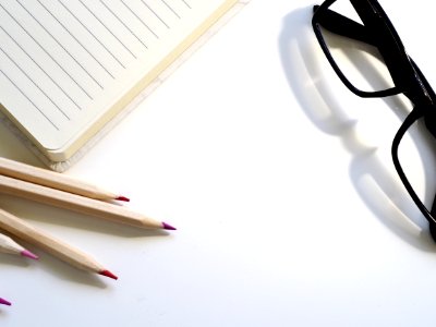 Black Framed Eyeglasses On Desk