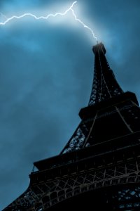 Low-angle Photo Of Eiffel Tower Struck By Lightning photo