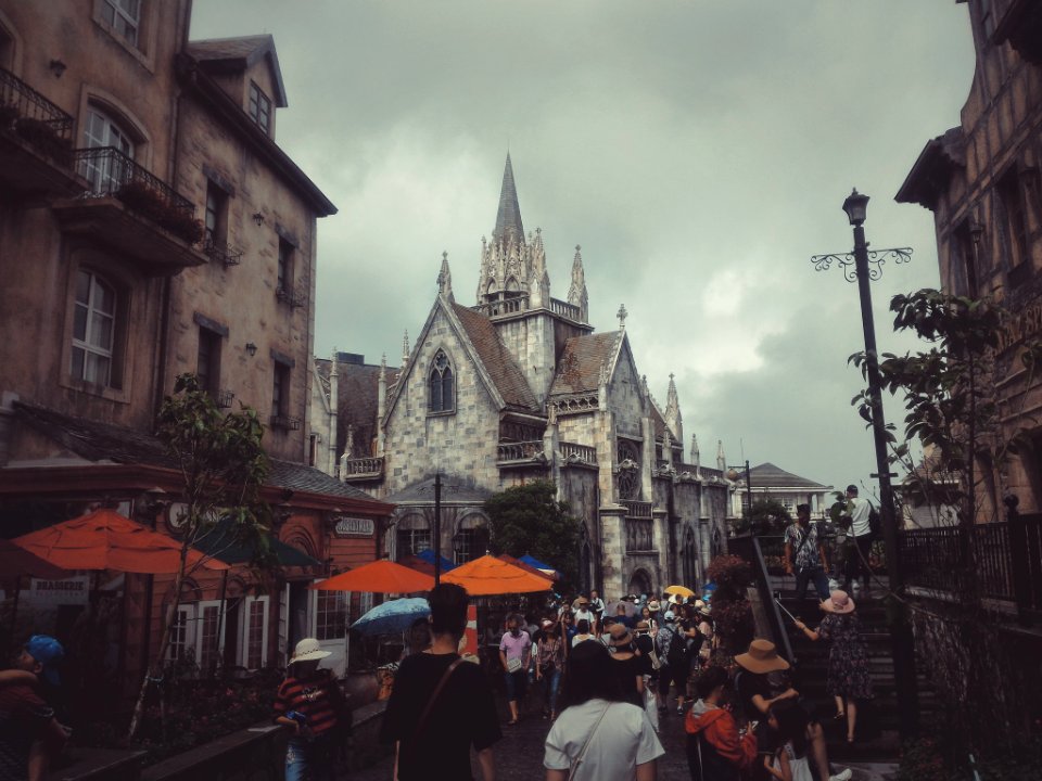 Photography Of People Walking On Street Near Buildings