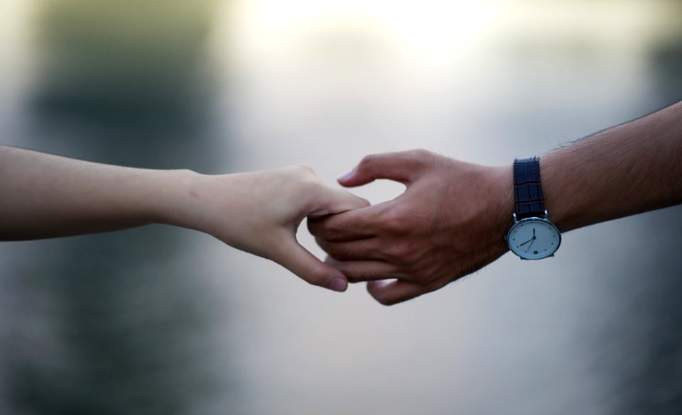 Photo Of People Holding Hands