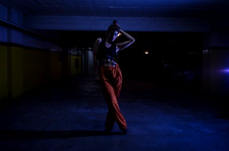 Woman Wearing Black Crop-top And Orange Pants Inside Parking Lot