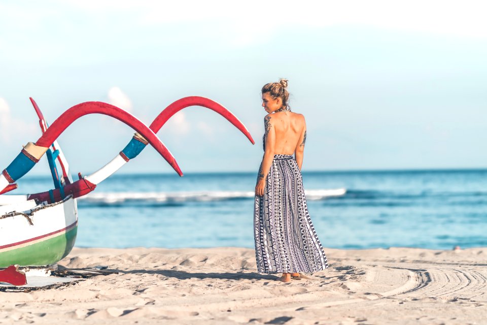 Photo Of Woman Standing On Seashore