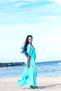 Woman In Teal Dress On Seashore photo