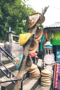 Photo Of Hats Hanging On Tree