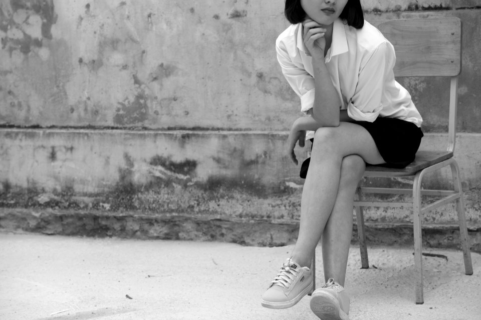 Grayscale Photography Of Woman Wearing White Shirt And Black Skirt photo