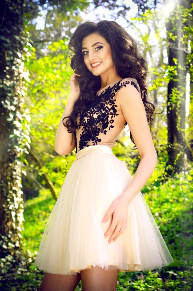Woman Wearing White And Black Lace Sleeveless Mini Dress