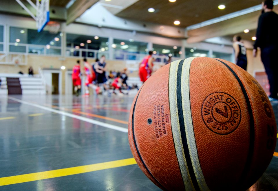 Brown Basketball On Grey Floor
