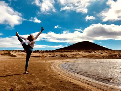 Woman Wearing White Long-sleeved Shirt And Blue Denim Jeans photo