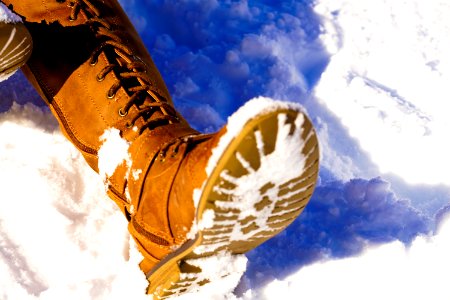Persons Left Foot On Snowfield
