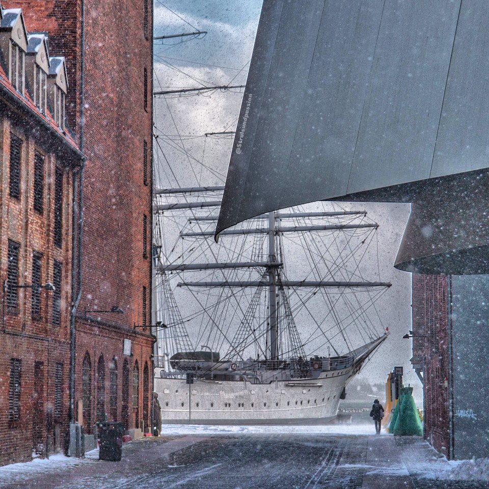 Painting Of Man Standing Near White Sailing Ship photo