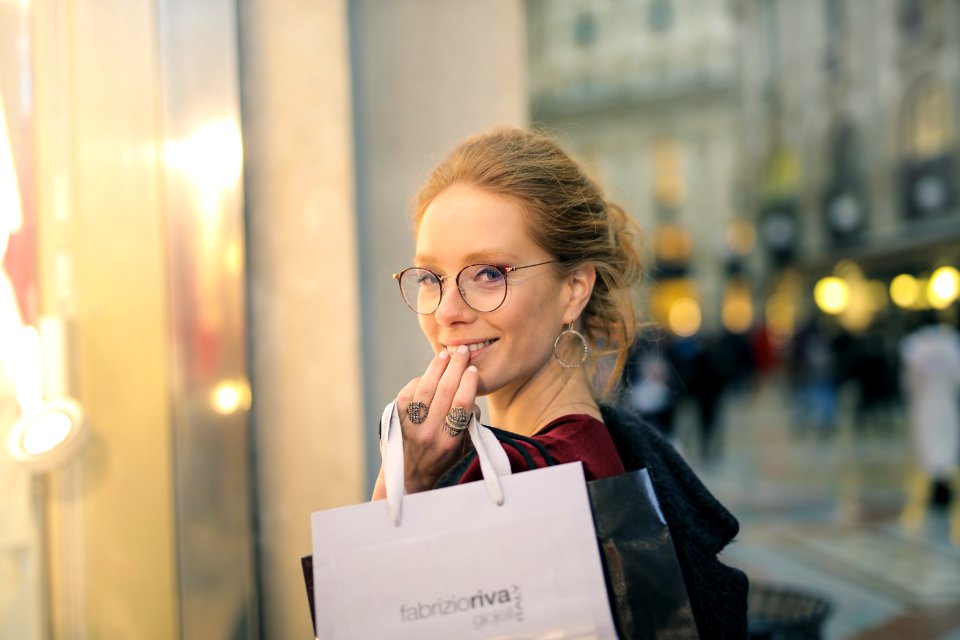 Close-Up Photography Of A Woman Holding Paper Bags