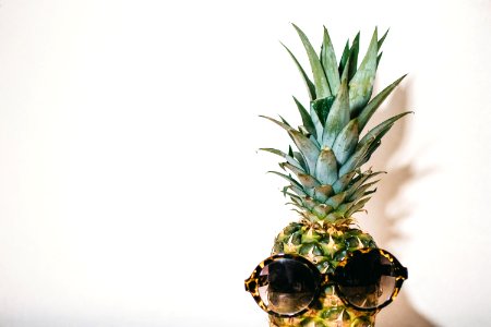 Close-Up Photography Of Eyeglasses On Pineapple photo
