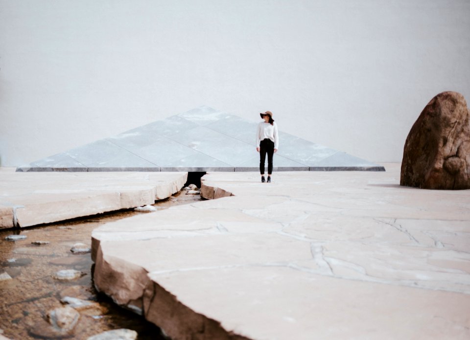 Woman Standing Near Big Rock