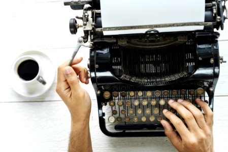 Person Typing Using Typewriter photo