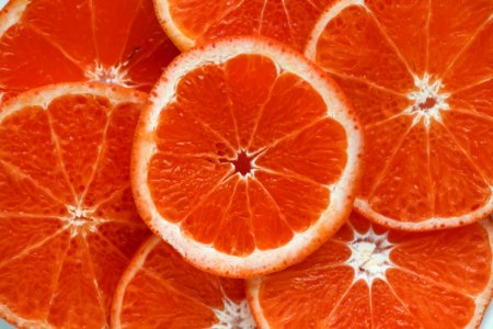 Close Up Photograph Of Slices Orange Citrus Fruits photo