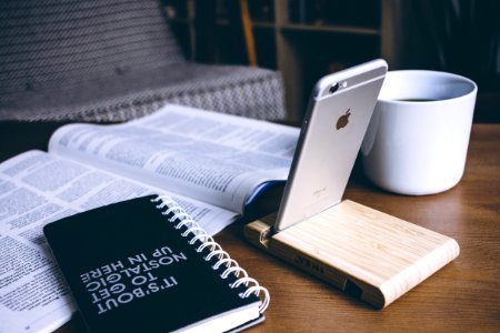 Book And Silver Iphone 6 On Top Of Table photo