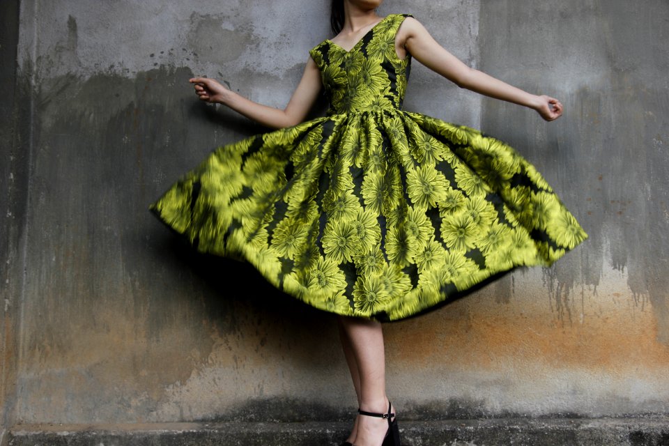 Photo Of A Woman Wearing Green Dress