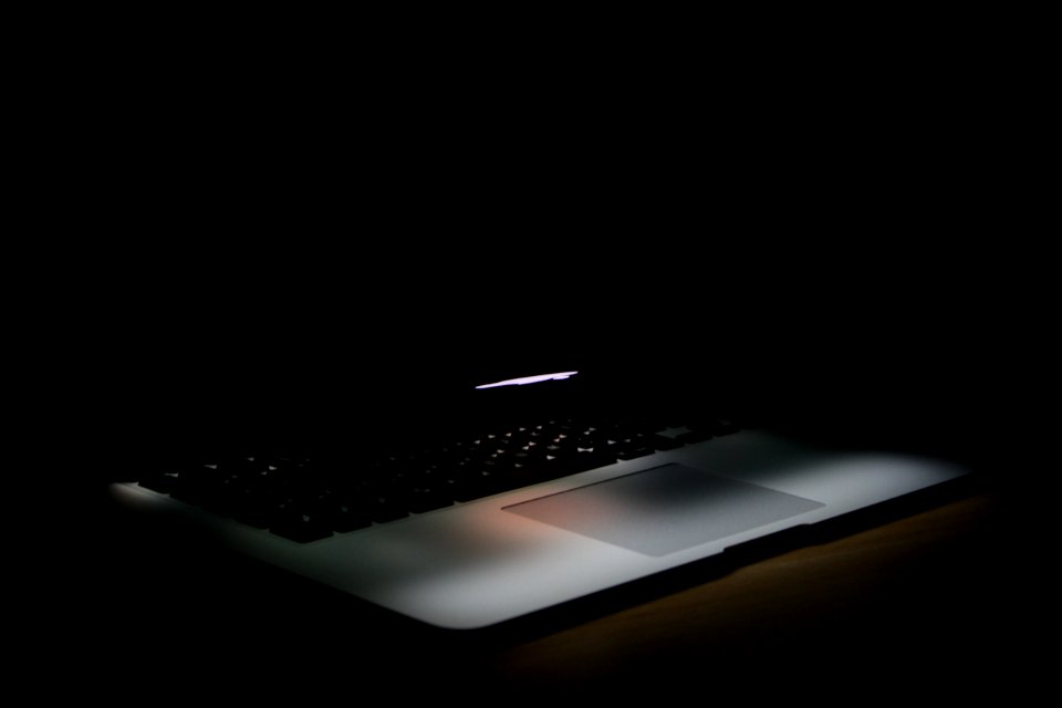 Photography Of Laptop In A Dark Area